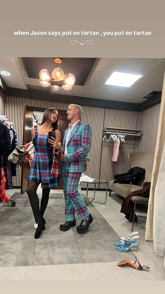 Jake Shears and Lola Consuelos take a sefie in a full length mirror