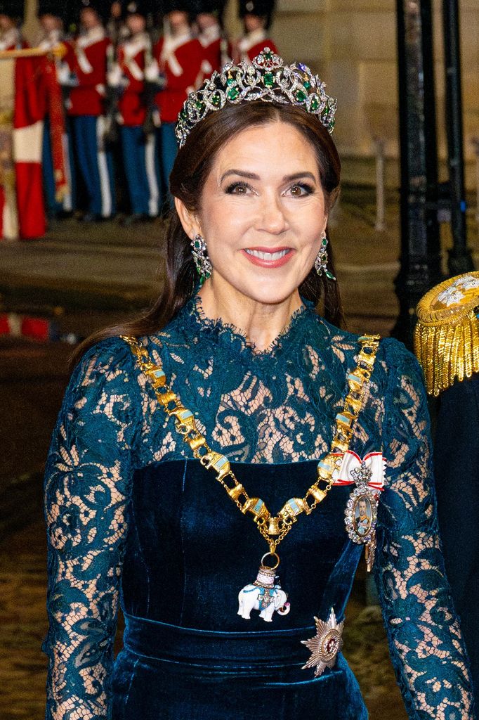 danish royal lady in green velvet dress and tiara