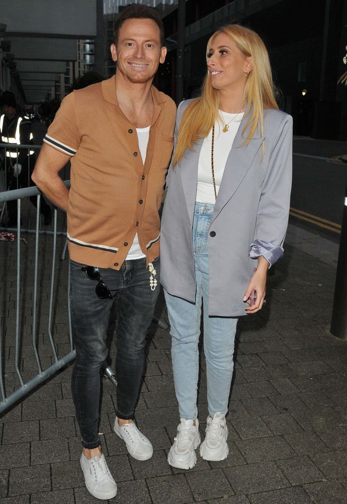 Joe Swash in a brown shirt and Stacey Solomon in a grey blazer