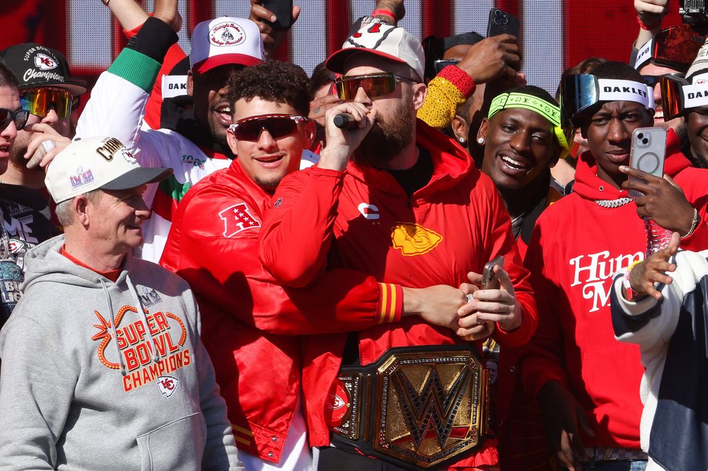Patrick Mahomes #15 and Travis Kelce #87 of the Kansas City Chiefs address the crowd during the Kansas City Chiefs Super Bowl LVIII victory parade on February 14, 2024 in Kansas City, Missouri.