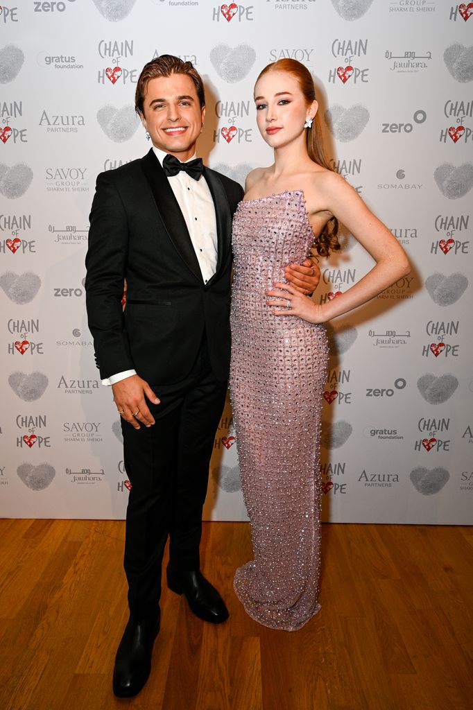 couple posing in smart clothes at charity ball