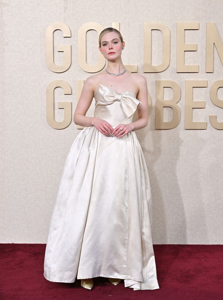Elle Fanning in off-white satin gown