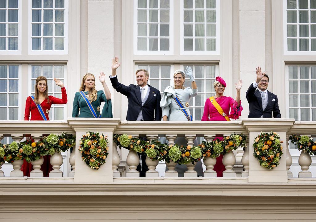 Princess Alexia of the Netherlands, Princess Amalia of the Netherlands, King Willem-Alexander of the Netherlands, Queen Maxima of the Netherlands, Princess Laurentien of the Netherlands and Prince Constantijn of the Netherlands wave to bystanders from the balcony of Noordeinde Palace