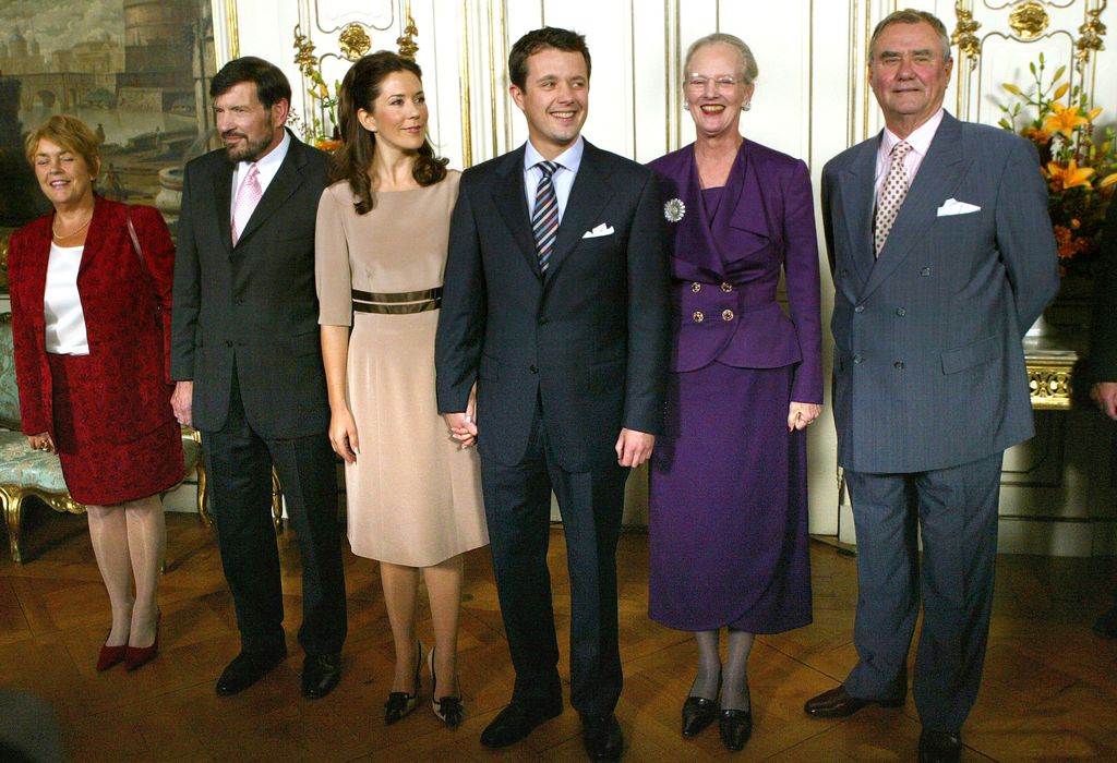 Mary Elizabeth Donaldson of Australia (3rd-L), with (L-R) her stepmother Susan Moody, father John, her fiancee Crown Prince Frederik, Prince Consort Henrik and Danish Queen Margrethe, stand together after the official announcement of Donaldson's engagement to Prince Frederik during a media conference 