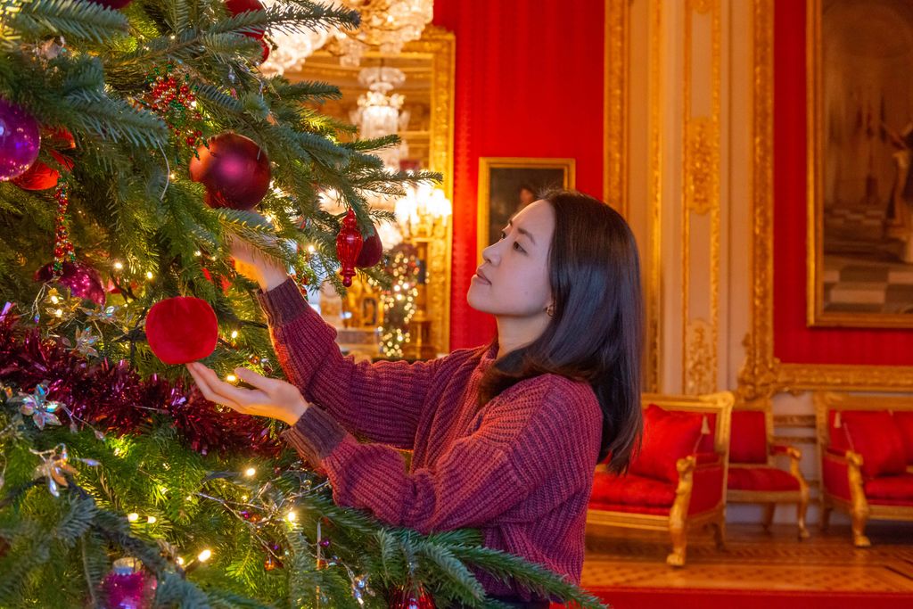 Red and gold decorations adorn the trees