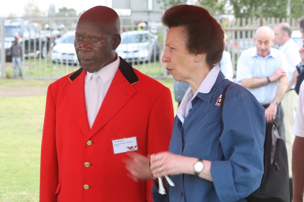 Princess Anne walking alongside Enos Mafokate