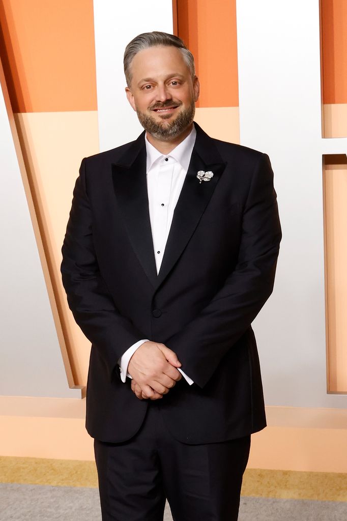 Nate Bargatze in black suit at 2025 Vanity Fair Oscar Party