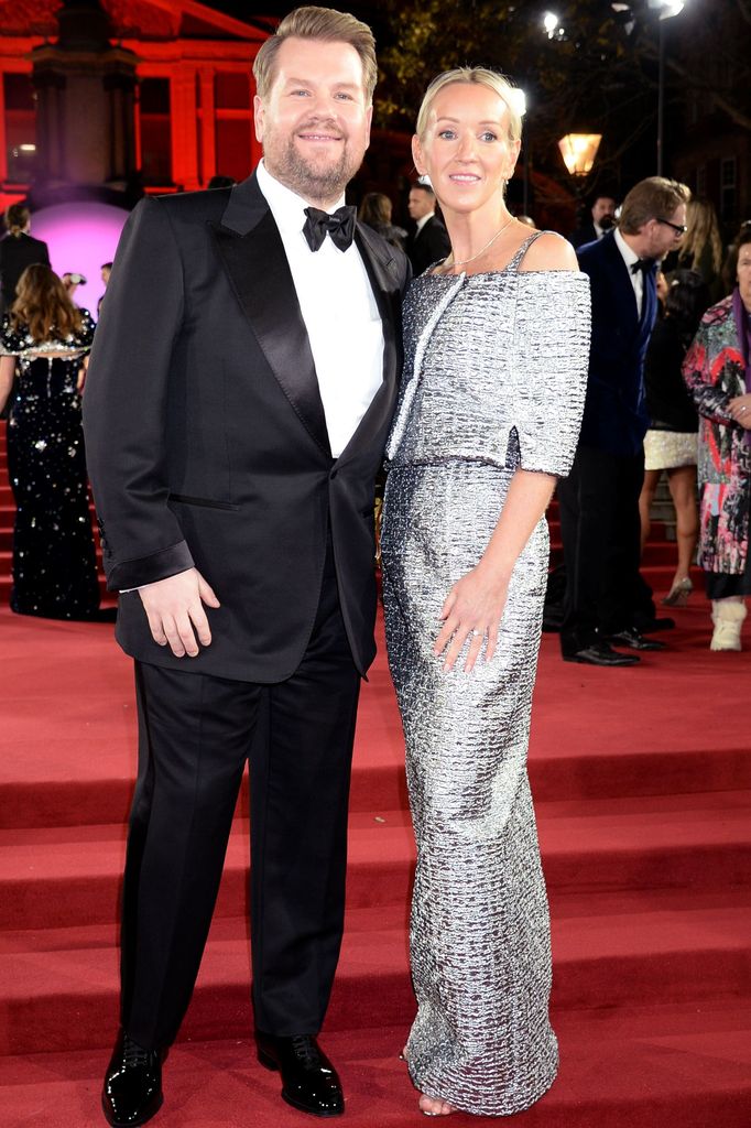 James Corden in a tuxe and wife Julia in a silver off-the-shoulder gown on the red carpet