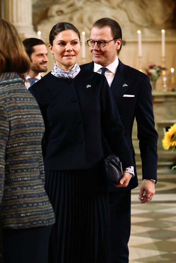 Crown Princess Victoria and Prince Daniel in black in chapel