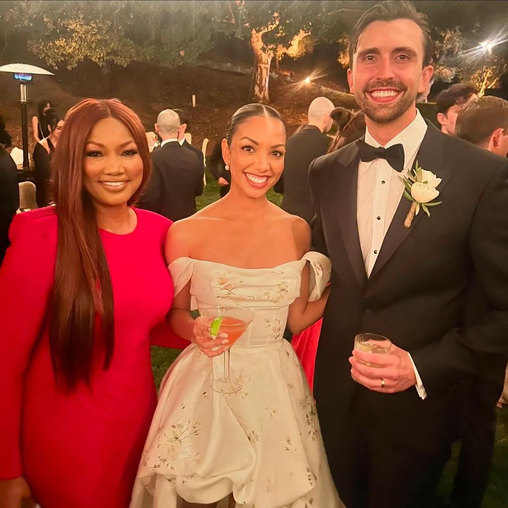 Garcelle Beauvais poses for a photo with Corinne Foxx and her new husband Joe Hooten at their wedding, shared on Instagram