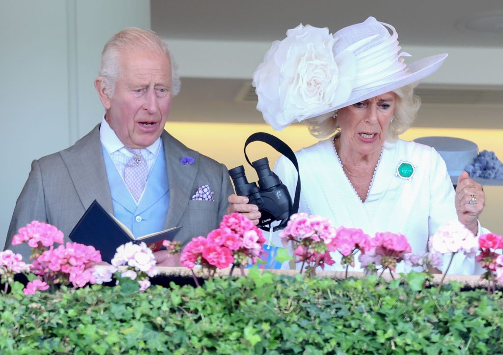  King Charles III and Queen Camilla react as they attend day three of Royal Ascot 2024