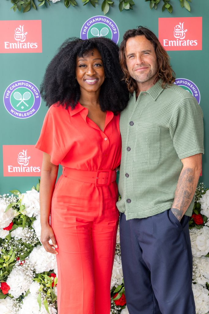 Beverly wore an eye-catching red jumpsuit to Wimbledon