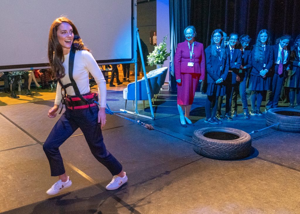 he Princess Of Wales pulling tire with body weight during visit to Landau Forte College 