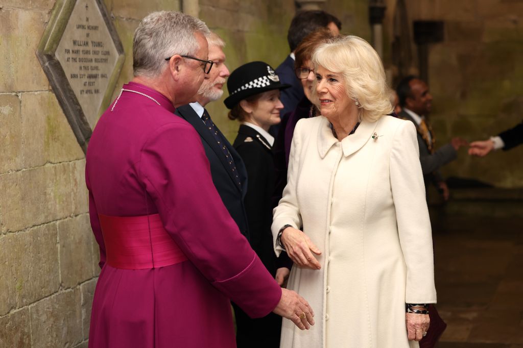 Camilla is greeted by The Rt Revd Stephen Lake, 79th Bishop of Salisbury upon her arrival at a musical evening at Salisbury Cathedral 