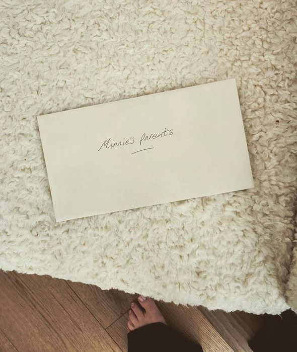 An envelope with the words Minnies parents written on it