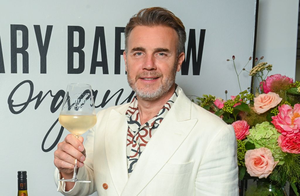 Gary Barlow raising a glass of wine at the launch of his wine brand