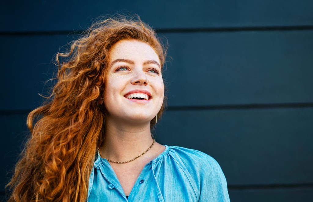Woman looking up smiling