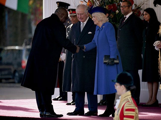 King Charles III and Camilla Queen Consort shake hands with South African President Cyril Ramaphosa