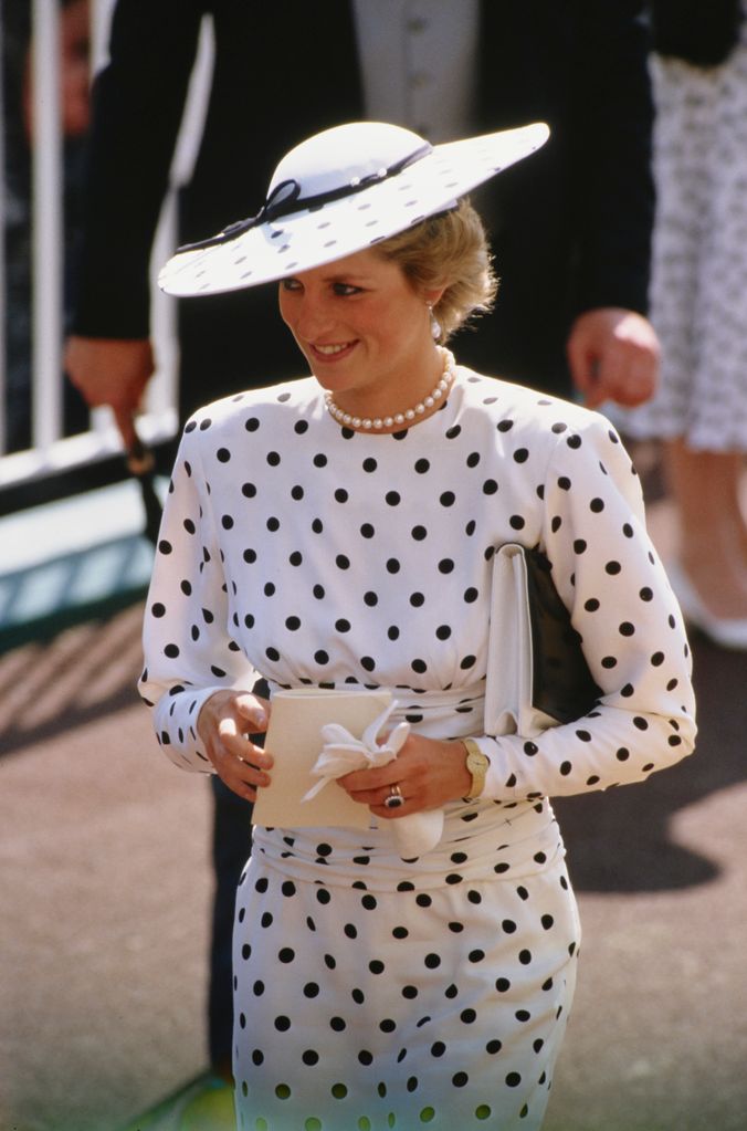 Diana, Princess of Wales attending the Ascot race meeting in England, wearing a black and white spotted dress by Victor Edelstein and a Philip Somerville hat, in 1988
