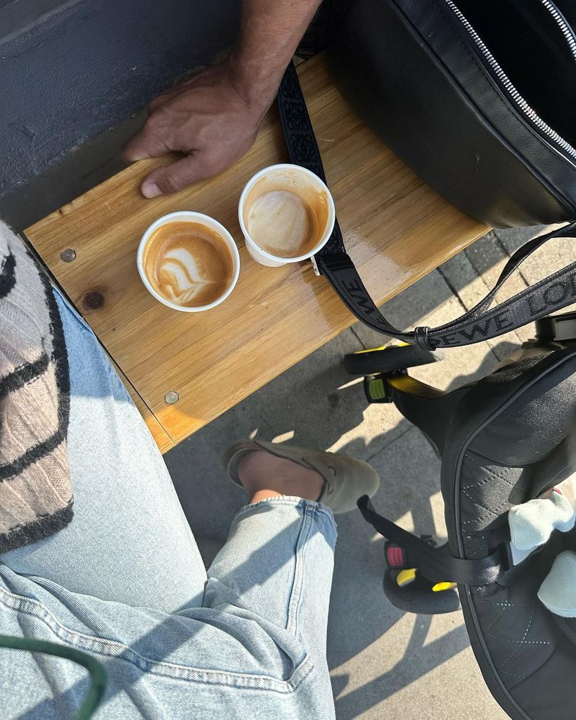 Photo showing bench with coffee and baby seat