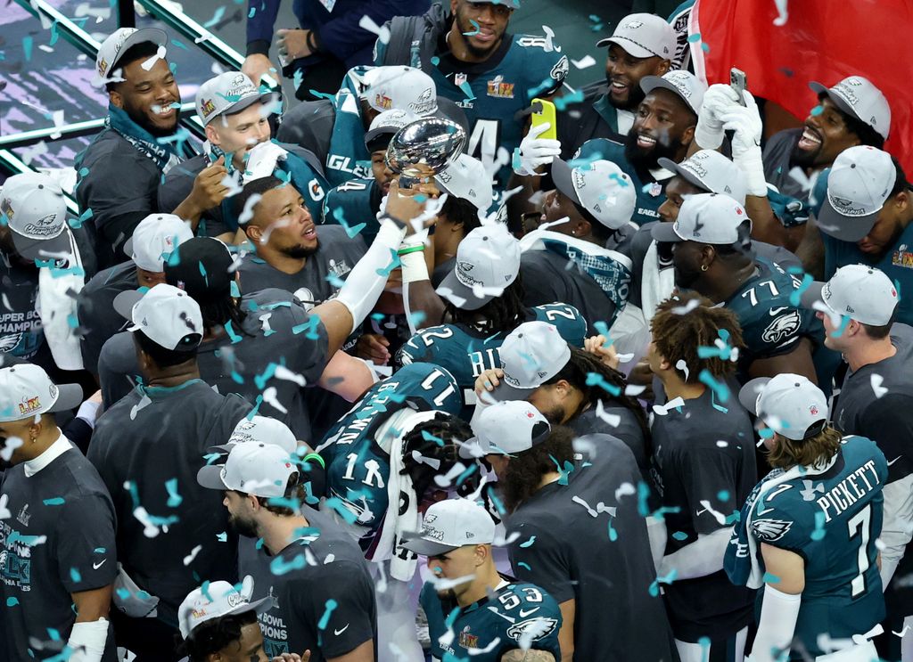 Saquon Barkley #26 of the Philadelphia Eagles celebrates wtih the Vince Lombardi Trophy after defeating the Kansas City Chiefs 40-22 to win Super Bowl LIX at Caesars Superdome on February 09, 2025 in New Orleans, Louisiana.