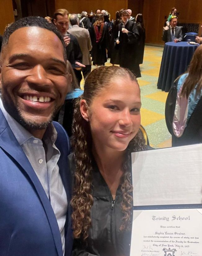 Michael Strahan with daughter Sophia at a graduation ceremony