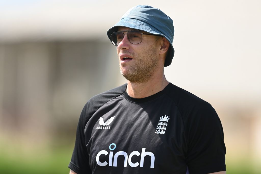 Freddie Flintoff in a black sports top and a blue bucket hat