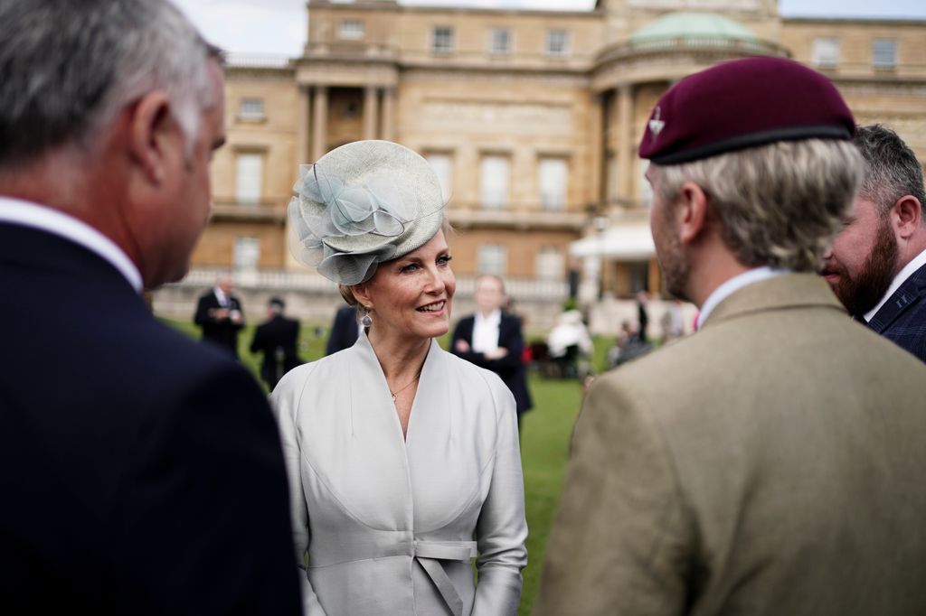 Duchess of Edinburgh speaking with veterans at garden party