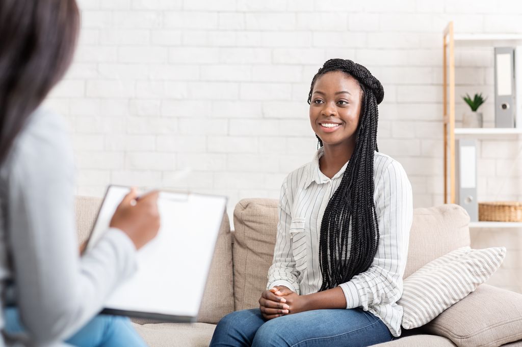 Woman smiling having therapy
