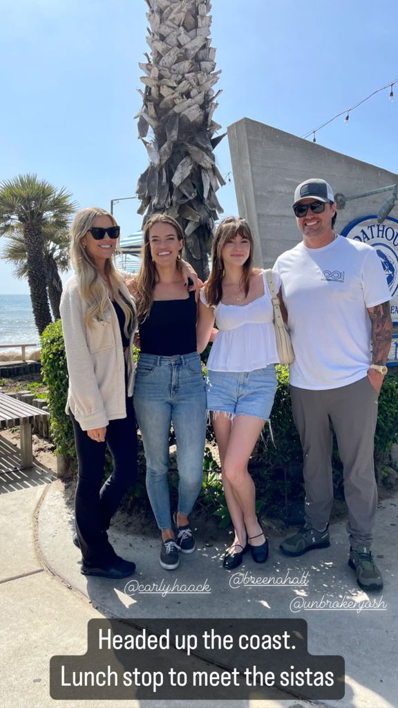 Christina Hall and Josh Hall bookend their sisters as they pose outside restaurant