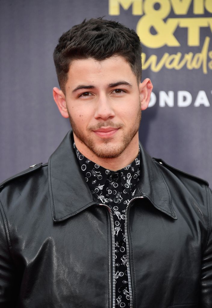 Nick Jonas is smiling 