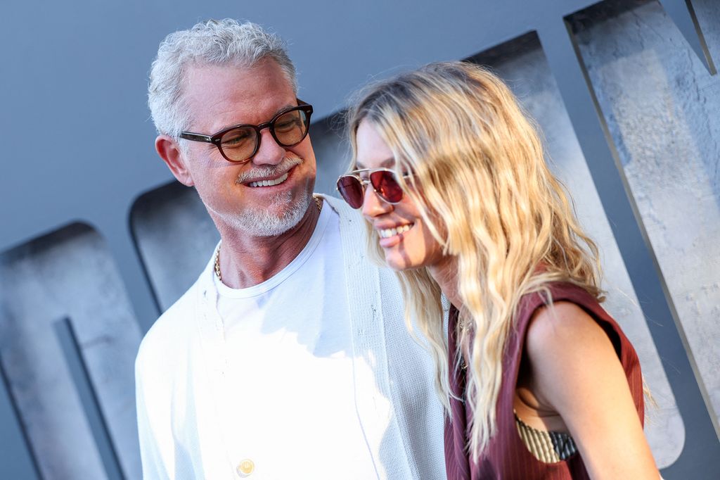 eric dane and janell shirtcliff gazing at each other red carpet debut