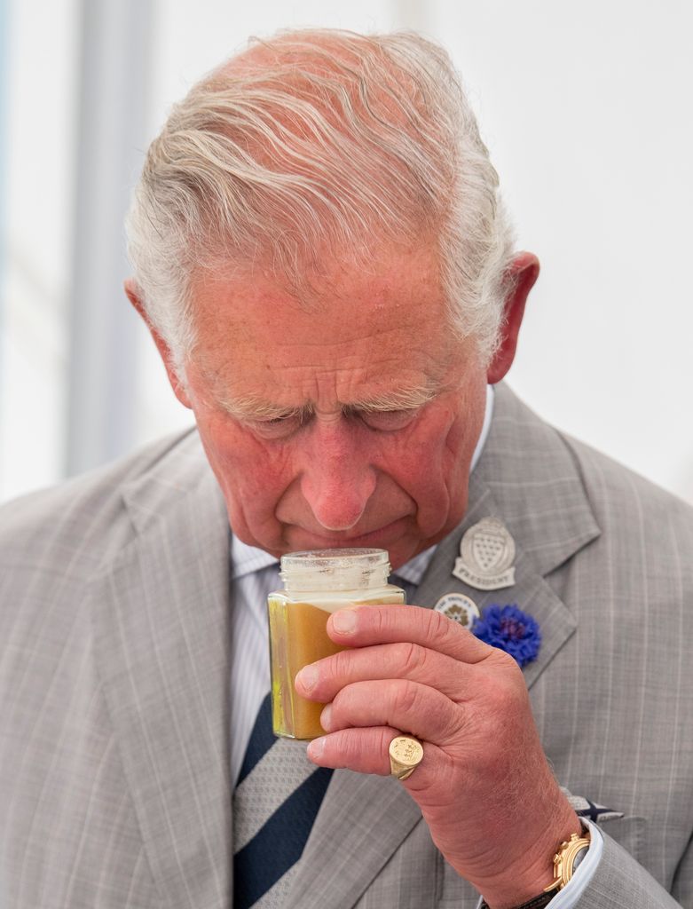 charles sniffing pot of honey