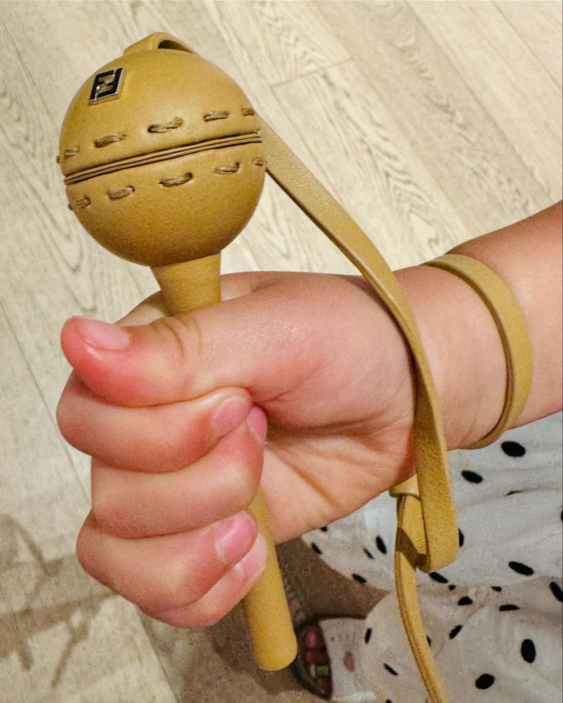 Katy Perry shares a photograph of her daughter Daisy Dove Bloom holding a Fendi lollipop holder, shared on Instagram