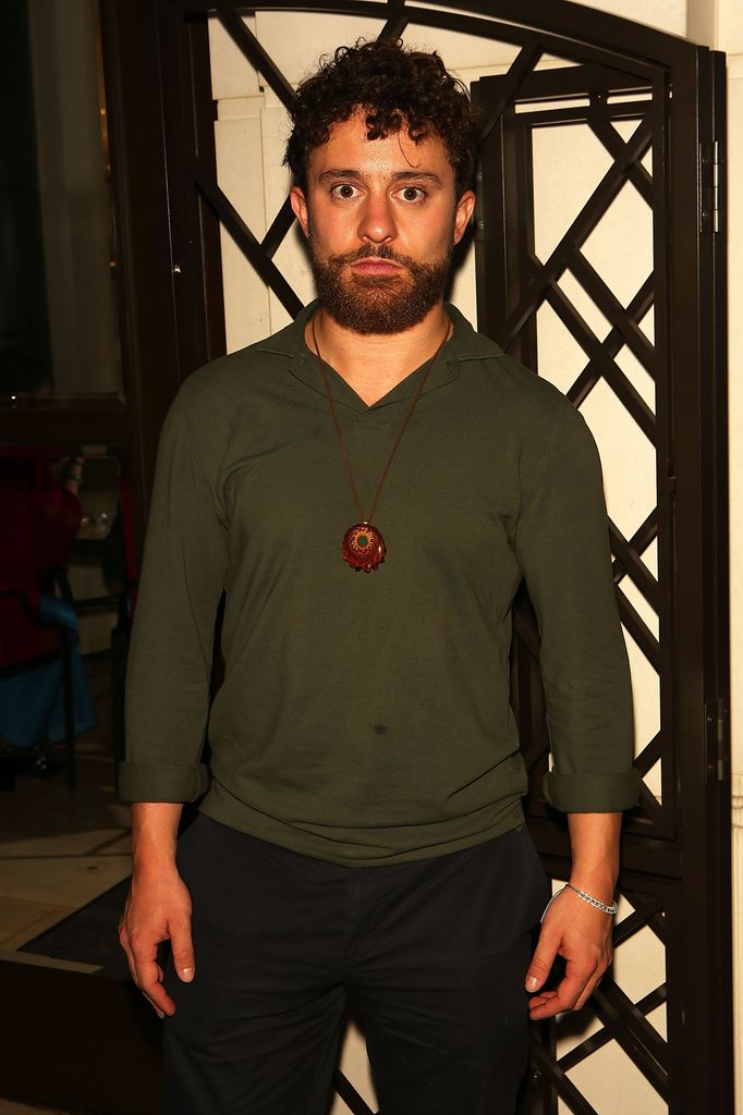 Edward Windsor, Lord Downpatrick, looking serious in  dark green jumper