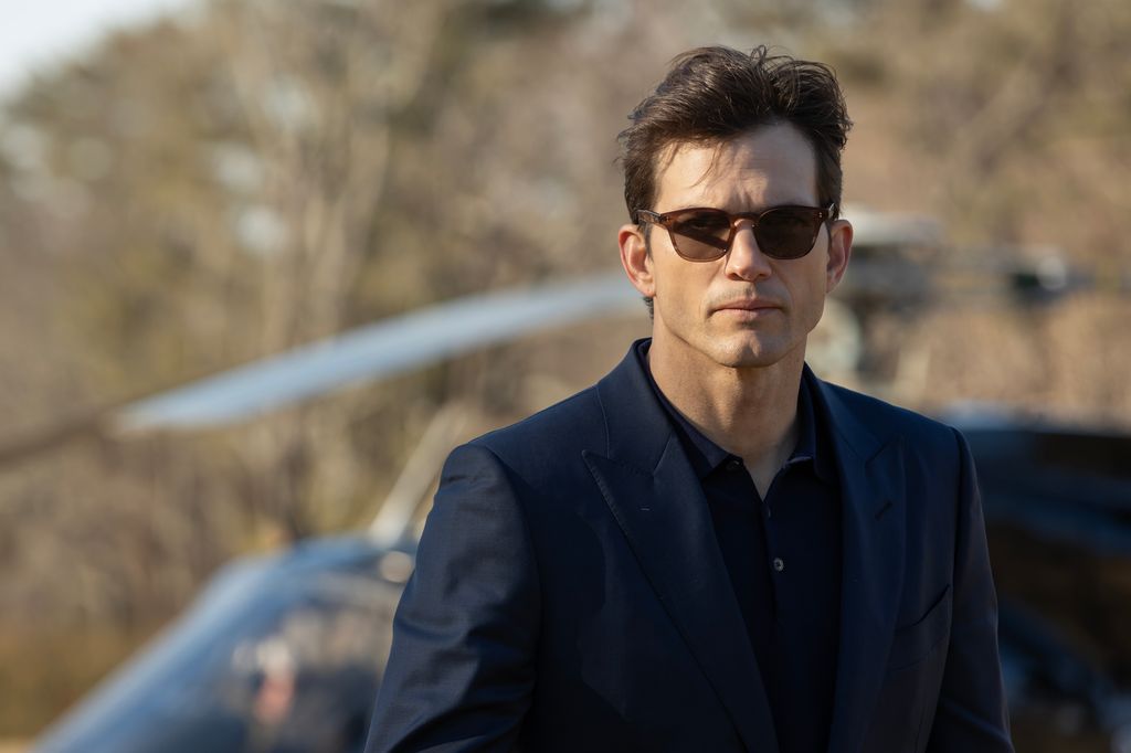 close-up man in suit and glasses