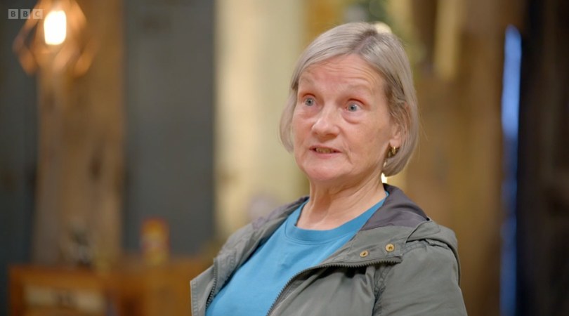 Close-up of lady with grey hair in barn