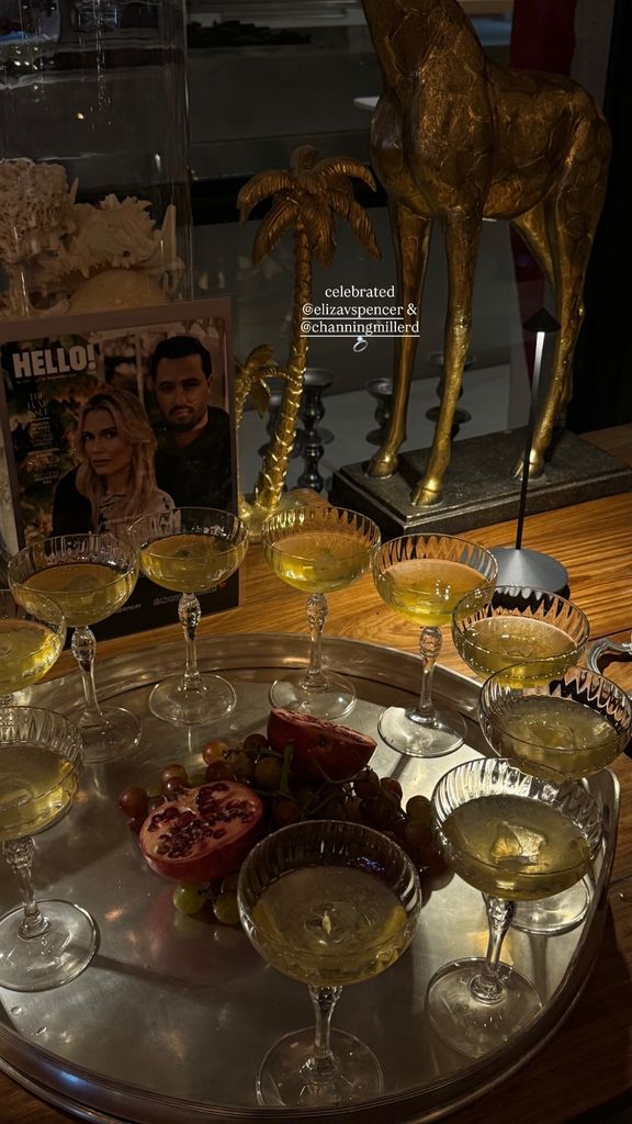 dimly lit table with wine glasses on tray