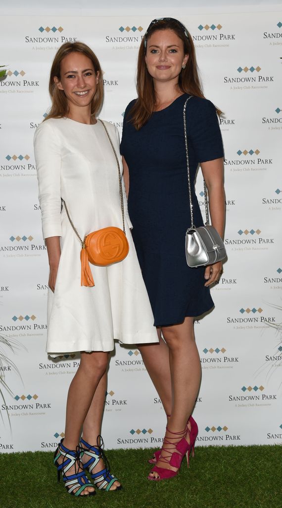 Lavinia Richards and Lady Natasha Rufus Isaacs pose in dresses