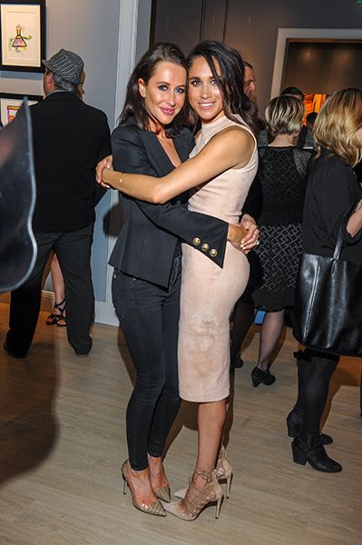 Jessica Mulroney and Meghan Markle hugging