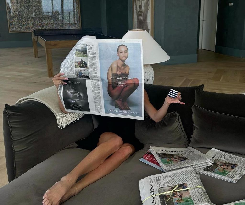 A photo of Victoria Beckham sitting on a sofa