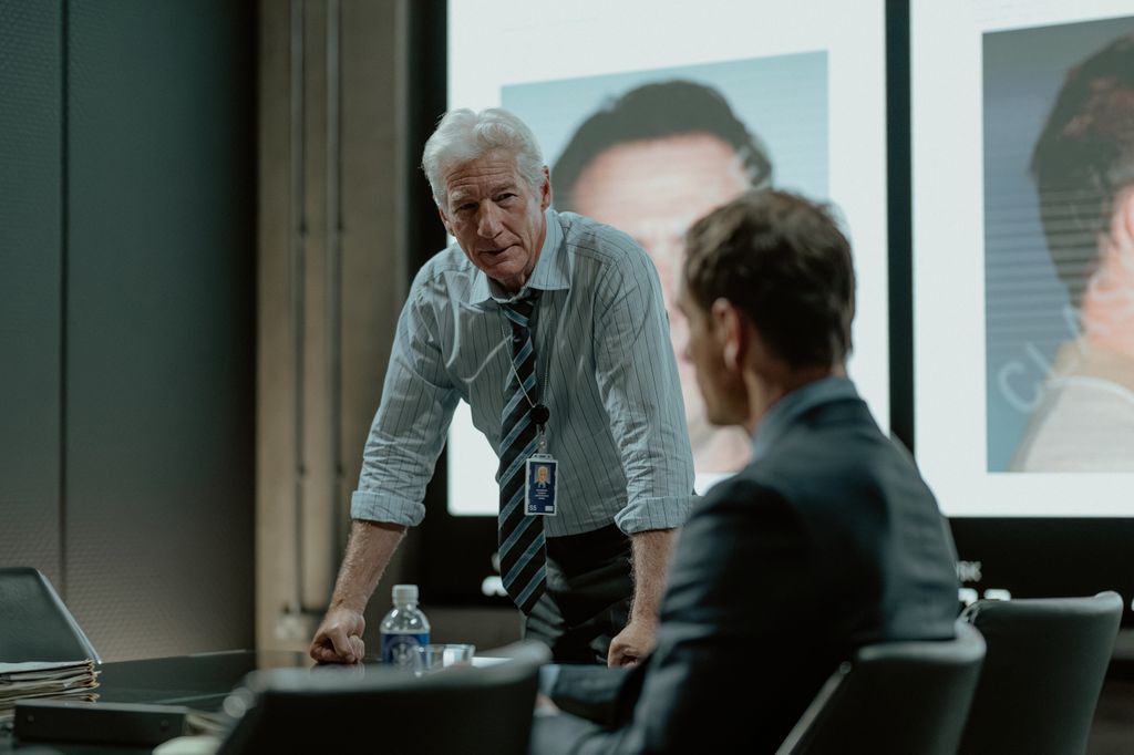 Richard Gere as Bosko and Michael Fassbender as Martian in The Agency