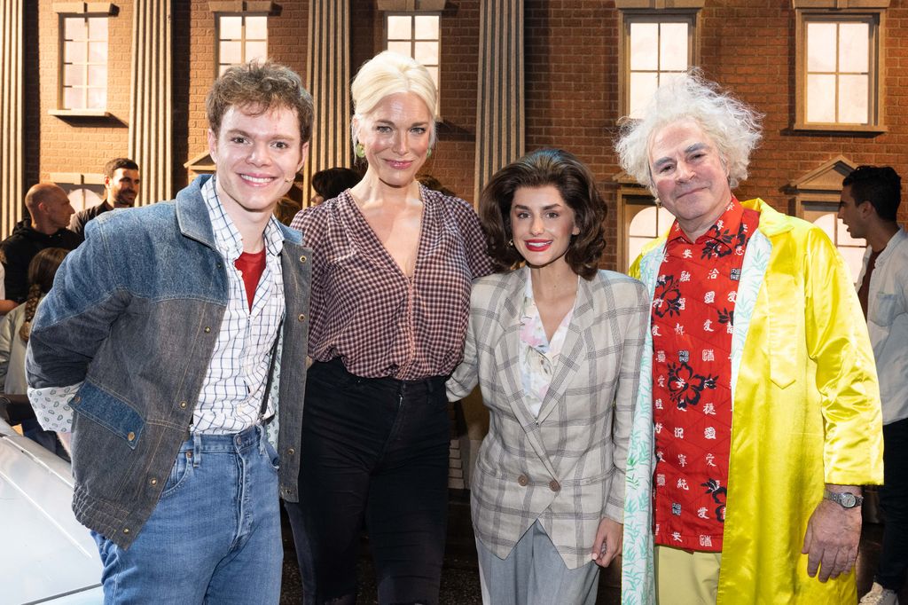 The cast of Back to the Future posing with Hannah Waddingham