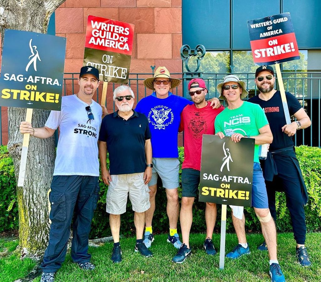 The team of NCIS, including leads Brian Dietzen and Sean Murray, on the picket lines