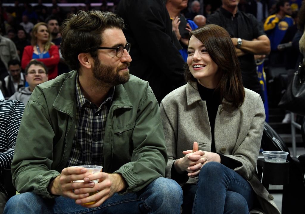 Emma Stone and Dave McCary attend the Golden State Warriors and Los Angeles Clippers basketball game at Staples Center on January 18, 2019 in Los Angeles, California