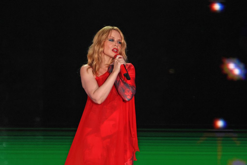 kylie singing in red outfit 