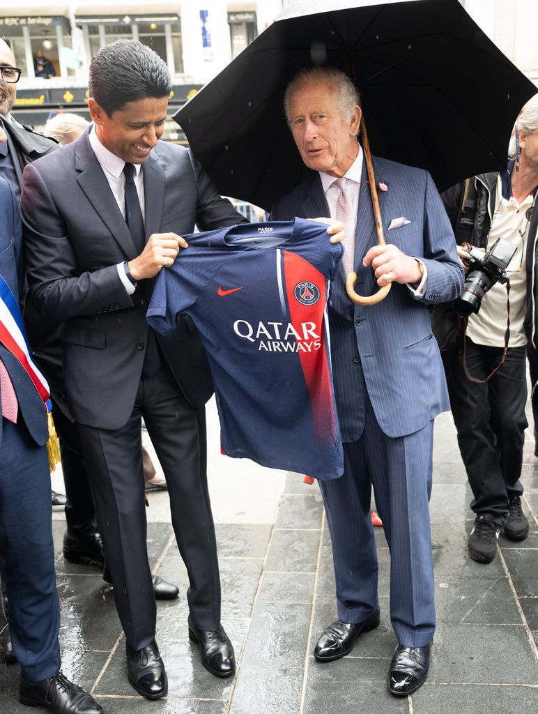 King Charles presented with PSG shirt by Nasser Al-Khelaifi