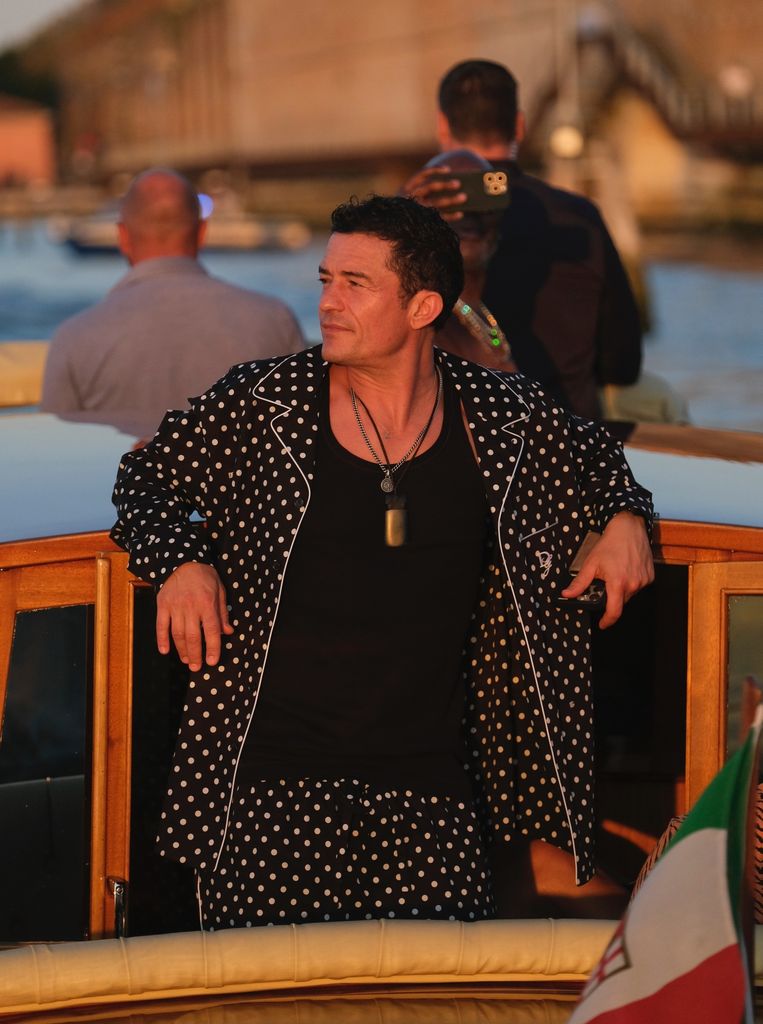 Orlando Bloom turns heads as he arrives by boat in Venice wearing matching polka dot pyjamas
