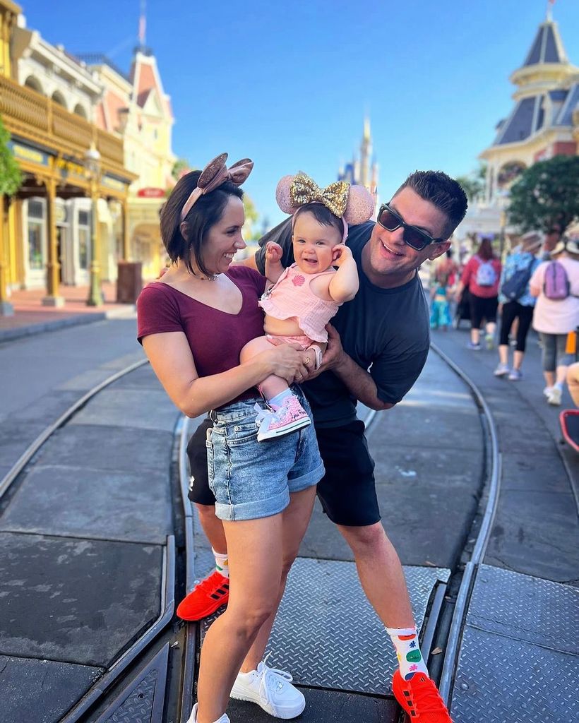 Janette Manrara, Aljaz Skorjanec and Lyra smile for photo at Disneyland