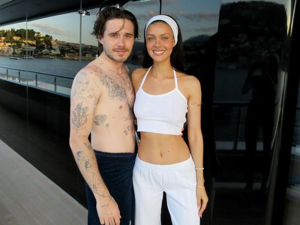 the peltz beckhams hugging while holidaying on a yacht